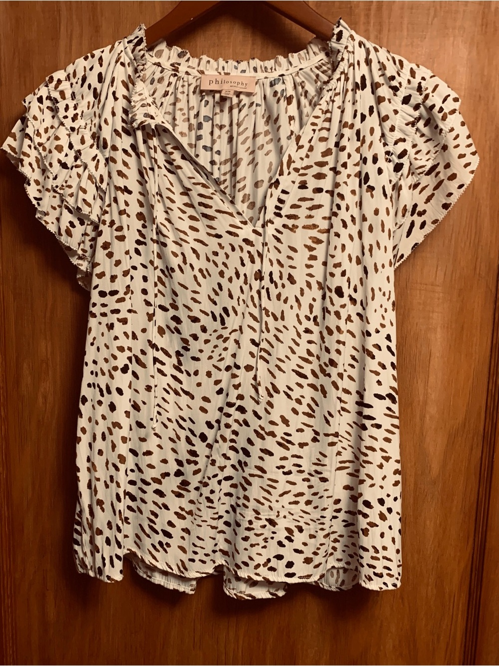 Philosophy Cream Top with Brown Leopard Spots; fringe edging on sleeves & collar